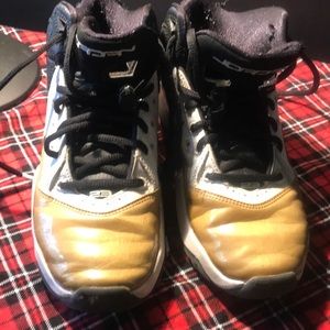 Youth boys Nike Air Jordans gold and black size 4.5y